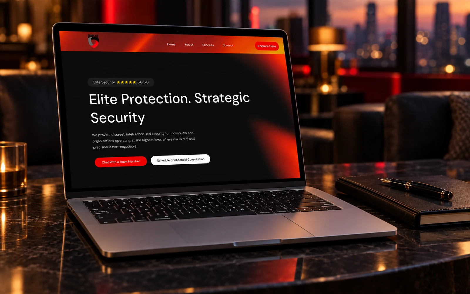 The Barricade website by Mike Bruce Design: the homepage on a laptop in a private hotel lounge